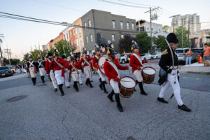 Uniformed drummers marching in a parade