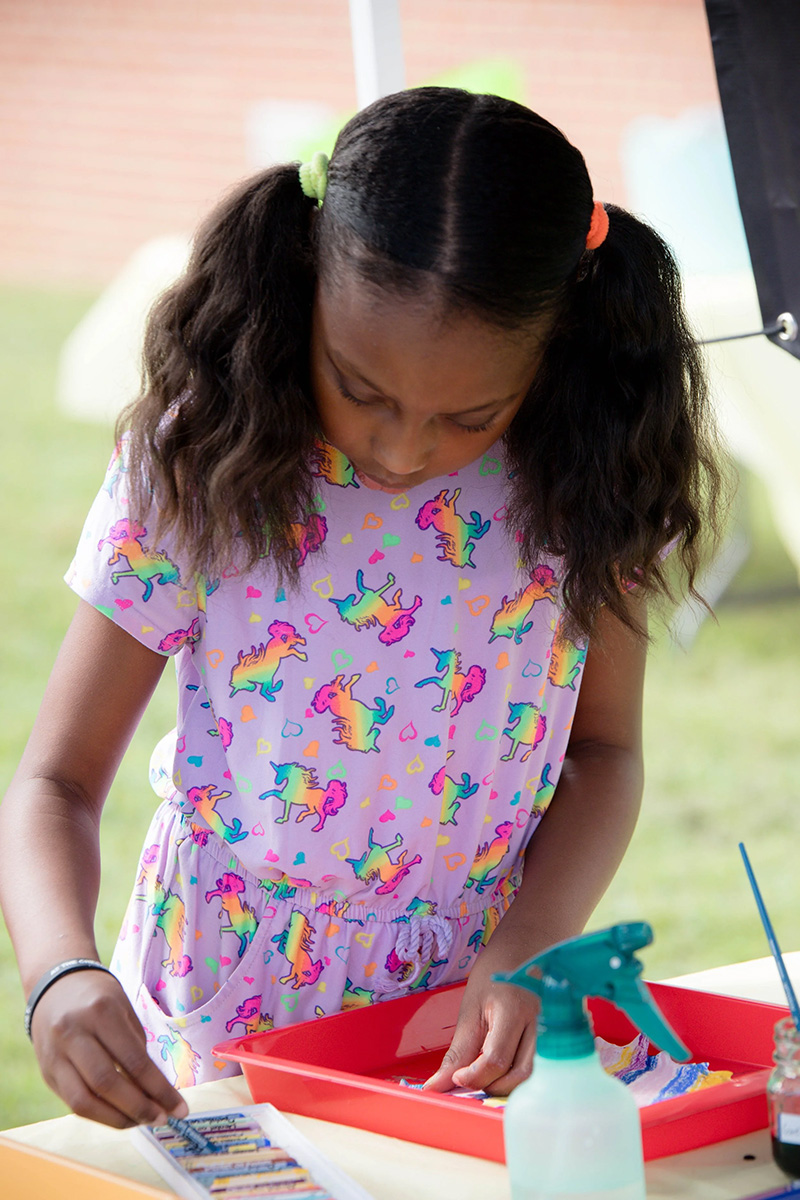 african american girl focused on coloring