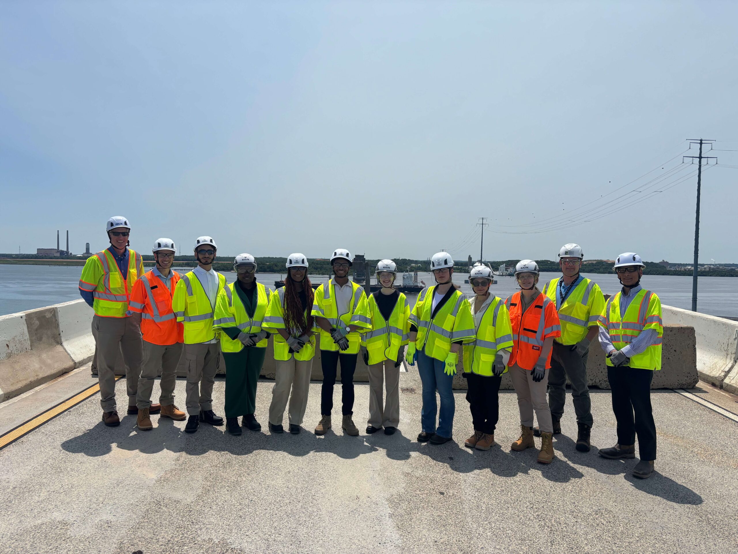 Interns wearing reflective vests at the site.