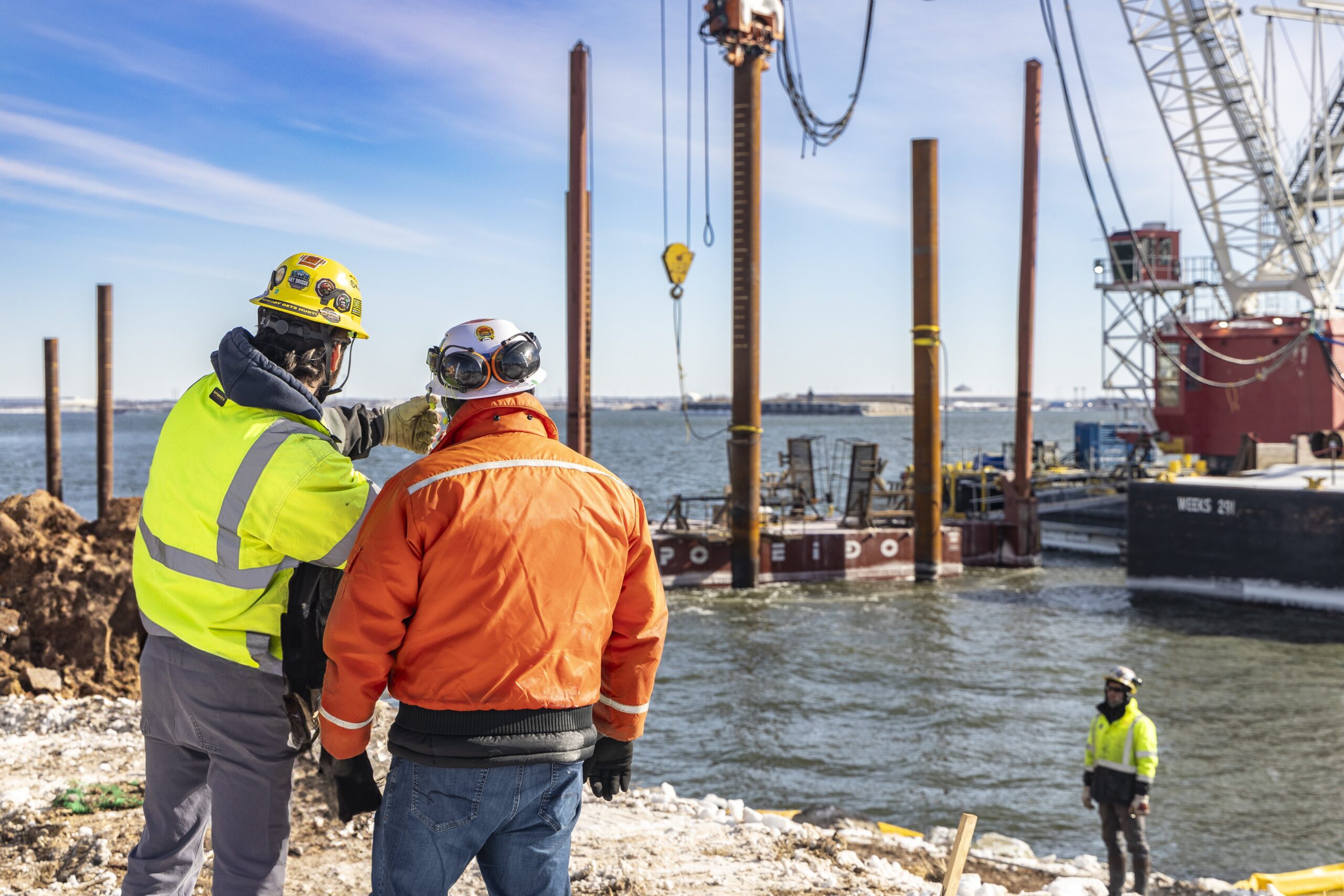 Two construction workers talking at the construction site
