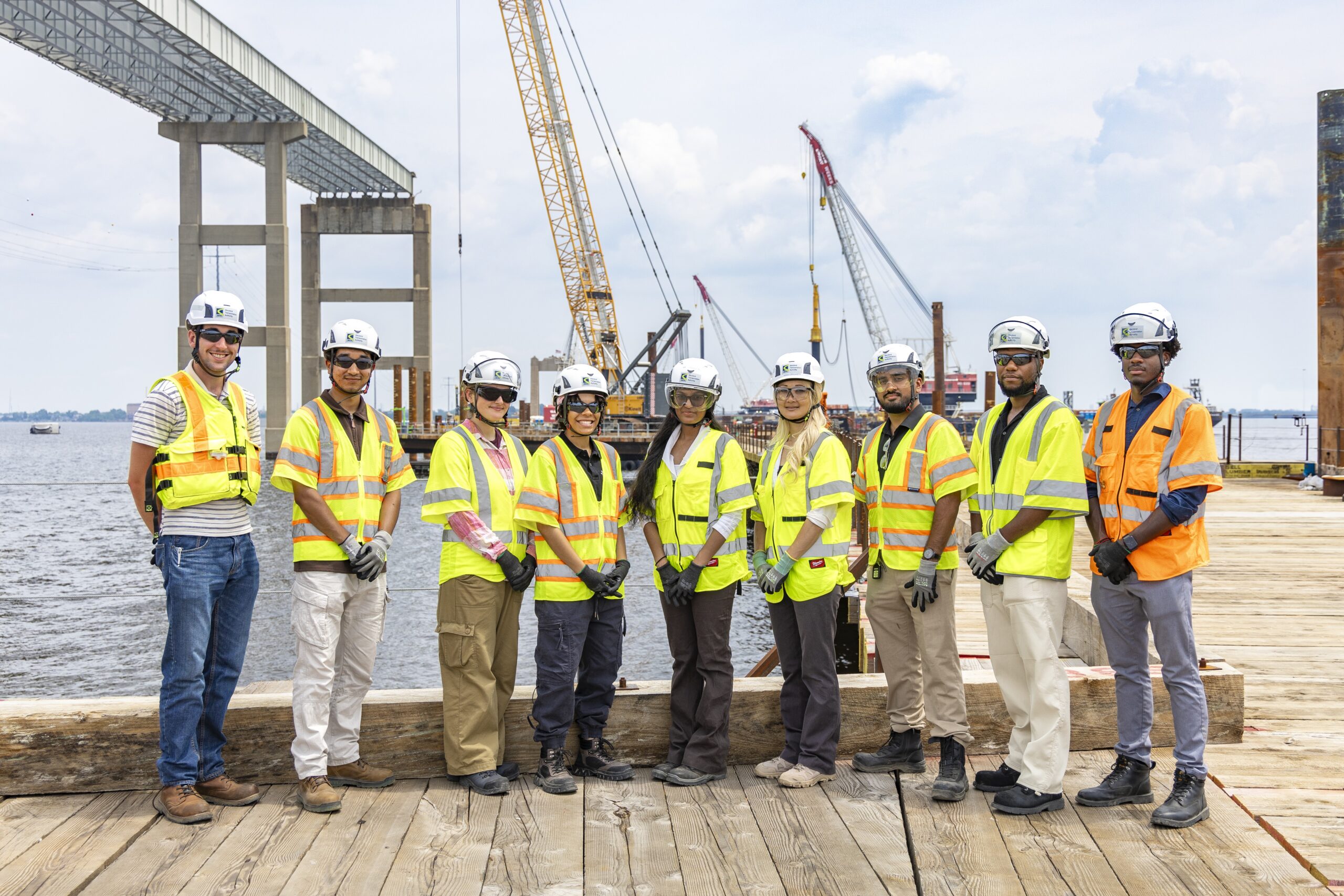 Image of people with hard hats and safety vests.